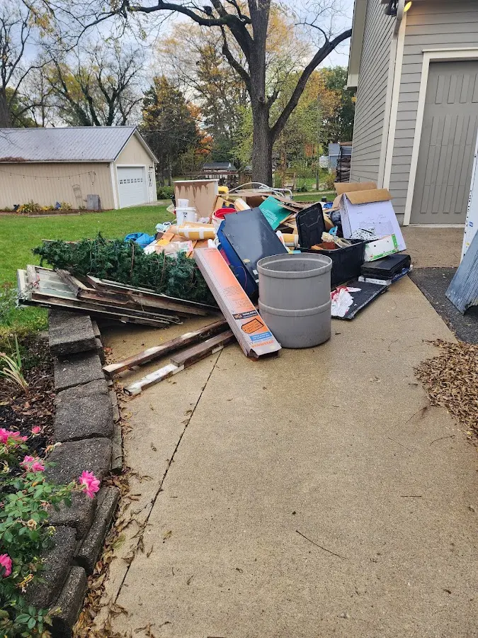 Dumpster being loaded with debris for 3 Yard Dumpster Rental in Battle Mountain